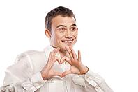 Portrait of happy man making heart from his hands on white background [IBR123723165]