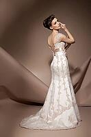 The beautiful young woman posing in a wedding dress [IBR123723169]