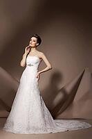 The beautiful young woman posing in a wedding dress [IBR123723175]