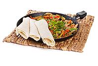 Traditional mexican beef fajitas with tortillas on white background [IBR123723195]