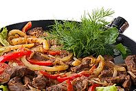 Traditional mexican beef fajitas on white background [IBR123723203]