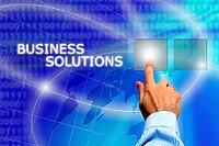 Man hand making a choice among various buttons - business solutions concept [IBR123760808]