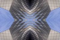 Abstract photography with a symmetrical, diamond-shaped shape that consists of repetitive lines and surfaces in shades of gray, white and blue and creates an impression of rhythm, depth and cool geometric harmony [IBR123760820]