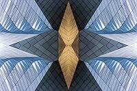 Abstract photography with symmetrical, sharp geometric forms of architecture in cool shades of gray and blue as well as warm beige, emphasizing the contrast of light, shadow and structure [IBR123760839]