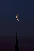 Crescent moon with waning moon over the spire of the pilgrimage church of St. Aegidius in Schildthurn, dawn, dawn, Lower Bavaria, Bavaria, Germany [IBR123760850]
