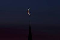 Crescent moon with waning moon over the spire of the pilgrimage church of St. Aegidius in Schildthurn, dawn, dawn, Lower Bavaria, Bavaria, Germany [IBR123760851]