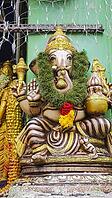 Ganesha statue with wreath rich in ornaments and colors, Singapore, Singapore [IBR123769650]