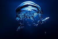 Abstract underwater oxygen bubble with blue backdrop [IBR123878843]