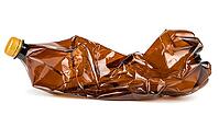 Crumpled brown plastic bottle isolated on white background [IBR123878852]