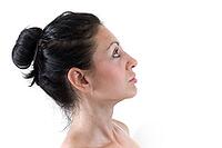 Close up of the face of a young woman with light skin and natural tones [IBR123878890]