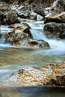 Raging clean fresh mountain river flowing between rocks [IBR123878894]