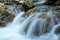 Raging clean fresh mountain river flowing between rocks [IBR123878896]