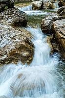 Raging clean fresh mountain river flowing between rocks [IBR123878898]