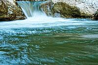 Raging clean fresh mountain river flowing between rocks [IBR123878901]