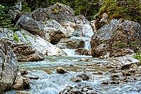 Raging clean fresh mountain river flowing between rocks [IBR123878902]