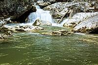Raging clean fresh mountain river flowing between rocks [IBR123878904]