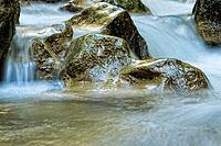 Raging clean fresh mountain river flowing between rocks [IBR123878909]