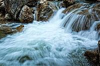 Raging clean fresh mountain river flowing between rocks [IBR123878911]
