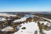 Aerial view of Rubbenbruchsee in winter with snow, Osnabrück, Lower Saxony [IBR123893368]