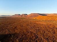 Aerial view, arid desert landscape, hills in Damaraland, Namibia [IBR123990976]