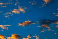 Aircraft contrails with red clouds, sunrise, Upper Austria [IBR123990982]