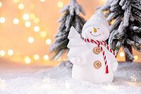 Snowman toy on the snow Christmas or New Year festive greeting card template [IBR123990987]