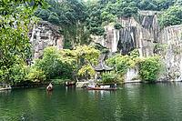The East Lake in Shaoxing City, Zhejiang Province, China, featuring beautiful mountains, clear waters, and distinctive wooden boats, is a national AAAA-level tourist attraction [IBR123990997]