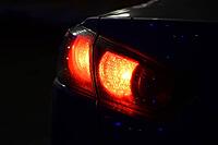 Discounted rear car lights in the dark. Stop signals [IBR123999808]