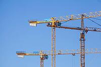 Construction cranes in the Überseestadt of Bremen, scaffolding, construction site, Bremen [IBR123999828]