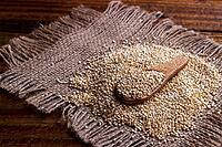 Heap of quinoa seeds, organic healthy vegan food on dark wooden background [IBR123999882]