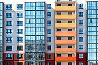 Facade fragment of new bright colorful modern residential building [IBR124036446]