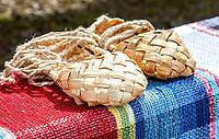Birchen woven bast shoes traditional Russian footwear. Wicker bast shoes on the vintage homespun doormat [IBR124036450]