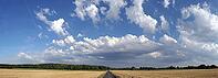 Dirt road with clouds [IBR124051655]