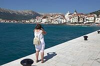 Woman on the coast of Basla on Krk, Croatia [IBR124051671]