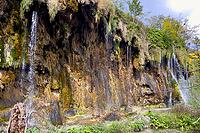 Long limestone wall with small waterfalls in the nature park, Plitvice Lakes, Lika-Senj County, Croatia [IBR124084172]