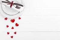 Romantic table setting on white wooden table Valentine's day card template [IBR124084180]