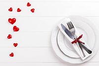 Romantic table setting on white wooden table.Valentine's day card template [IBR124084190]