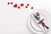 Romantic table setting on white wooden table.Valentine's day card template [IBR124084192]