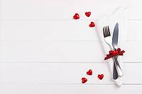 Romantic table setting on white wooden table.Valentine's day card template [IBR124084193]