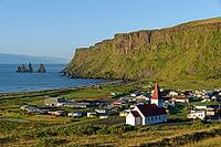 Vík í Mýrdal church, view over Vik and Reynisdrangar rocks, Vik, South Iceland, Iceland [IBR124192802]