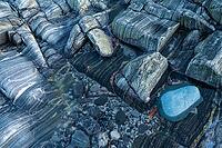 Rock structures on the coast, Söröya, Finnmark, Norway, February 2019 [IBR124200481]