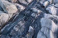 Rock structures on the coast, Söröya, Finnmark, Norway, February 2019 [IBR124200485]