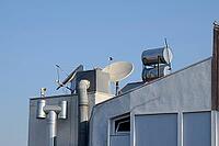 Steel barrels of boilers with water on the roof of a building to heat water. Water heating by the sun and solar panels. Antalya, Turkey [IBR124200538]