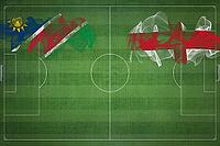 Namibia vs England Soccer Match, national colors, national flags, soccer field, football game, Competition concept, Copy space [IBR124240901]
