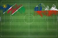 Namibia vs Chile Soccer Match, national colors, national flags, soccer field, football game, Competition concept, Copy space [IBR124240909]