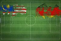 Malaysia vs Germany Soccer Match, national colors, national flags, soccer field, football game, Competition concept, Copy space [IBR124240975]