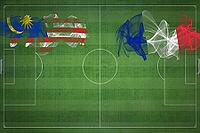 Malaysia vs France Soccer Match, national colors, national flags, soccer field, football game, Competition concept, Copy space [IBR124240976]