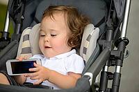 Portrait of young adorable baby boy with curly blond hair [IBR124308997]