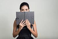 Studio shot of young beautiful Asian businesswoman against white background [IBR124308999]