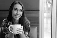 Portrait of young beautiful hipster woman relaxing at the coffee shop indoors in black and white [IBR124309002]